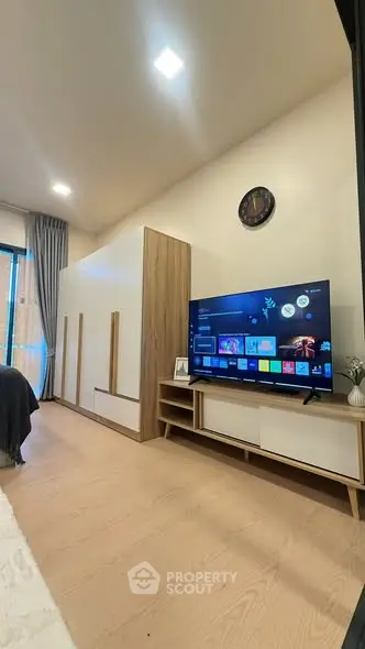 Modern living room with sleek TV setup and stylish decor