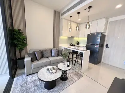 Modern open-layout living room with stylish kitchen and cozy seating area