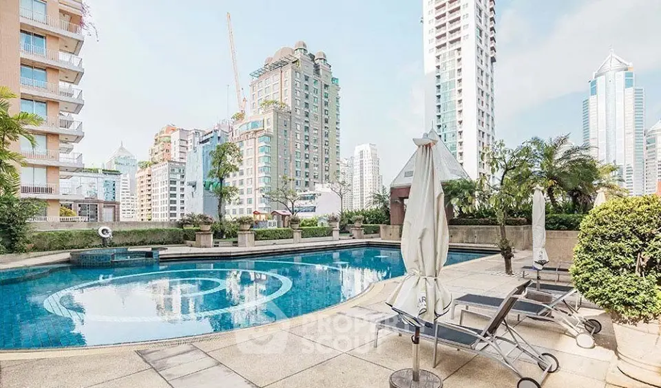 Luxurious urban pool area with city skyline views, perfect for relaxation and leisure in a prime location.