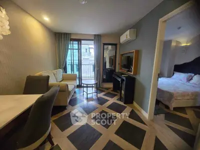 Modern living room with stylish flooring and cozy bedroom view