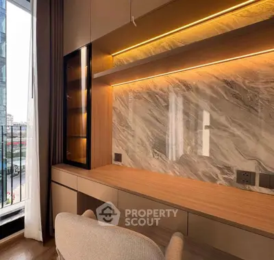 Modern study area with elegant marble backsplash and built-in shelving, overlooking a city view.