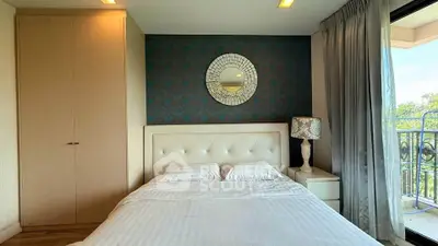 Elegant bedroom with stylish decor and balcony view in modern apartment