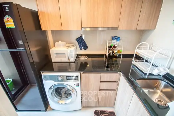 Modern kitchen with sleek appliances and wooden cabinetry