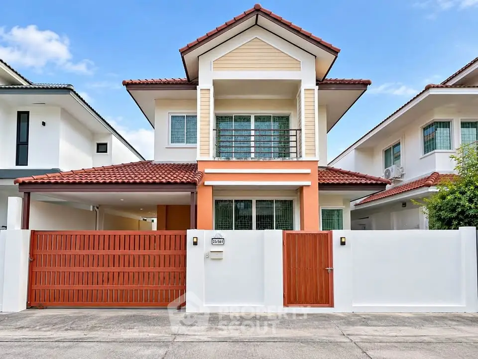 Charming two-story house with red roof and modern facade in a serene neighborhood.
