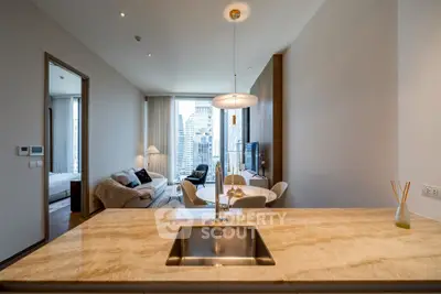 Luxurious open-plan living room with city view and modern kitchen island