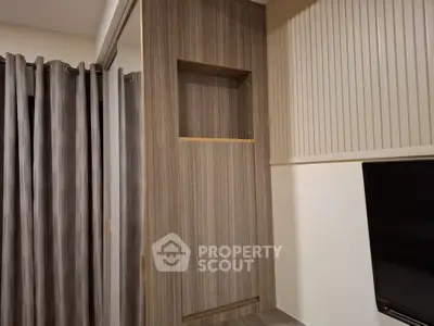 Modern interior with stylish wood paneling and elegant curtains in a cozy living space.