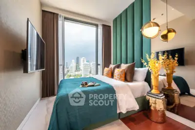 Luxurious bedroom with city view, elegant decor, and modern furnishings.