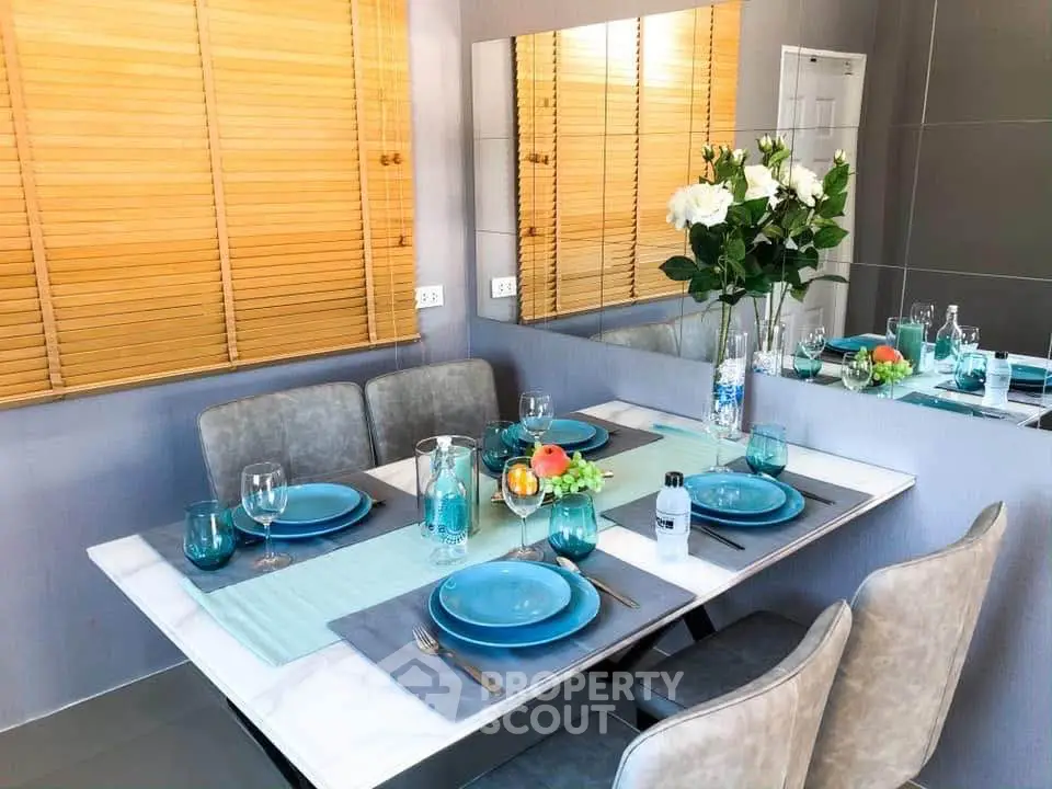 Elegant dining area with modern decor and stylish table setting