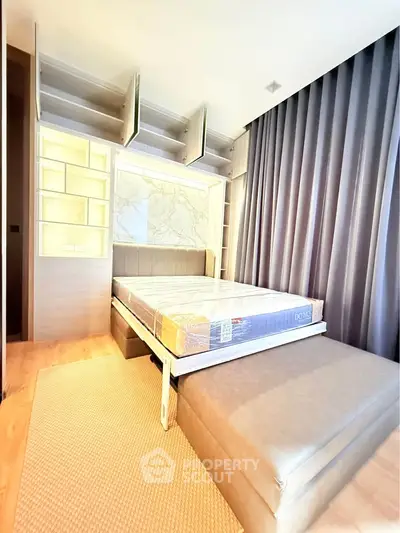 Modern bedroom with stylish built-in storage and cozy lighting