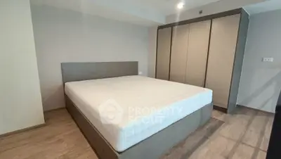Modern bedroom with sleek wardrobe and minimalist design
