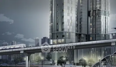 Modern high-rise building with sleek design and urban transit view, showcasing contemporary architecture.