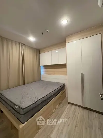 Modern bedroom with built-in storage and cozy lighting