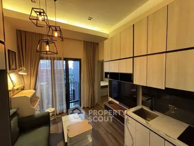 Modern living room with stylish lighting and balcony view in a cozy apartment.