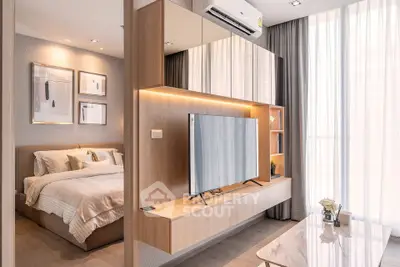 Modern bedroom with stylish decor and wall-mounted TV, featuring large windows and elegant lighting.