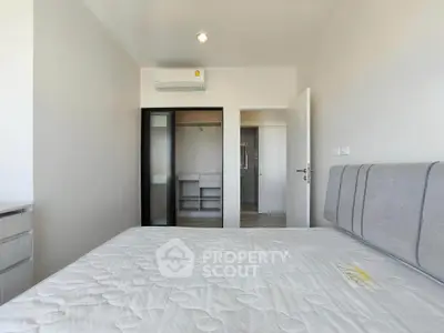 Modern bedroom with minimalist design and built-in wardrobe