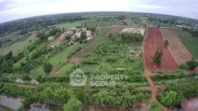 Expansive aerial view of lush green farmland with potential for development