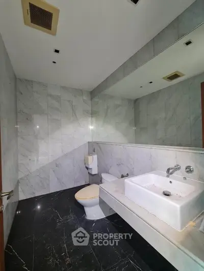 Luxurious marble bathroom with modern fixtures and sleek design