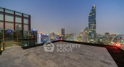 Stunning rooftop view of city skyline with modern architecture and vibrant lights.