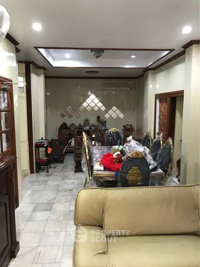 Spacious living room with elegant furniture and decorative accents, perfect for family gatherings.