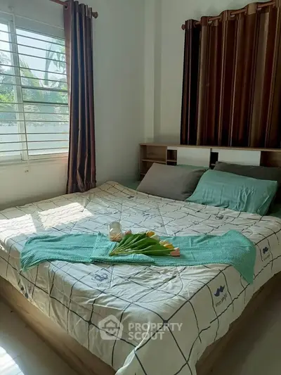 Cozy bedroom with natural light and stylish decor