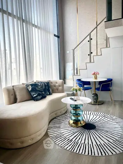 Luxurious modern living room with high ceilings and elegant decor