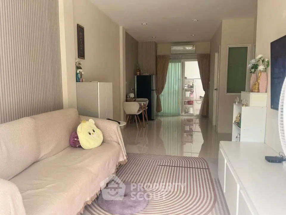 Spacious living room with modern decor and cozy seating area