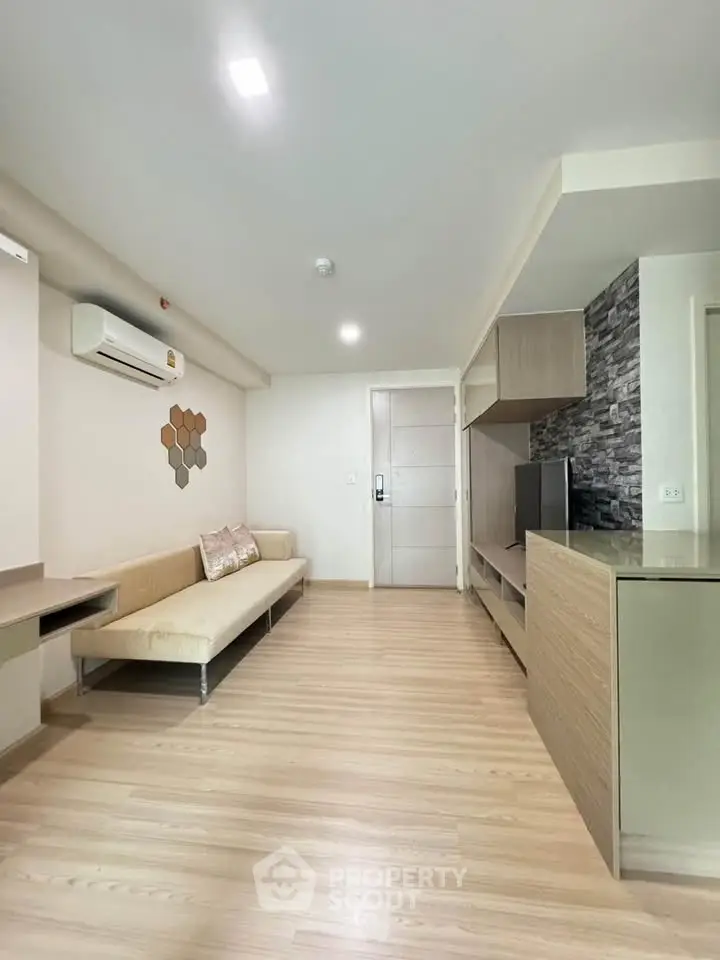 Modern living room with sleek design and air conditioning in a stylish apartment.