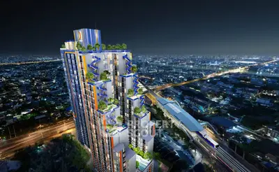 Stunning night view of modern high-rise building with lush rooftop gardens in urban cityscape.