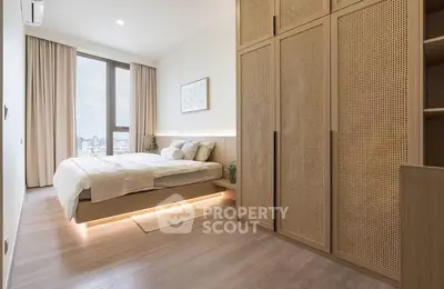 Modern bedroom with city view and stylish wooden wardrobe