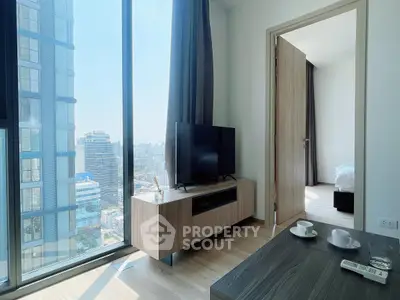 Modern living room with city view and sleek furniture in high-rise apartment