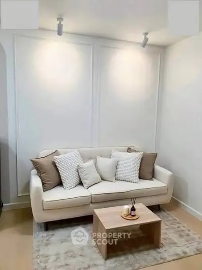 Cozy living room with modern white sofa and stylish decor