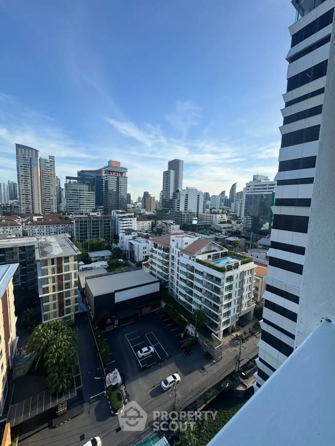 Stunning cityscape view from high-rise balcony showcasing modern urban living.