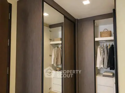 Spacious walk-in closet with modern design and ample storage space.