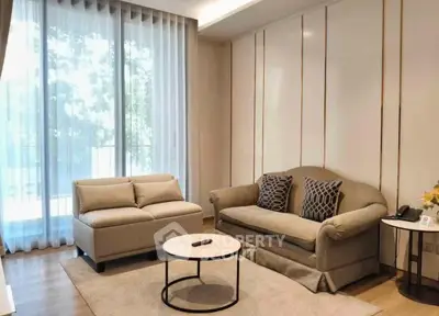 Elegant living room with modern furniture and large window view