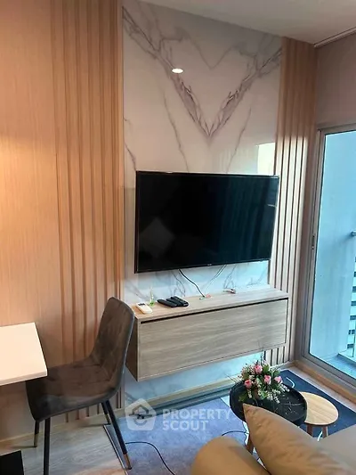 Modern living room with wall-mounted TV and stylish decor