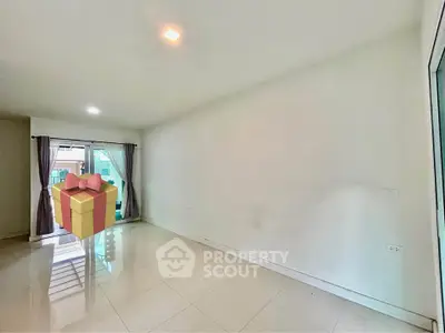 Spacious empty room with large windows and glossy tiled floor
