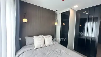 Modern bedroom with stylish lighting and sleek closet design