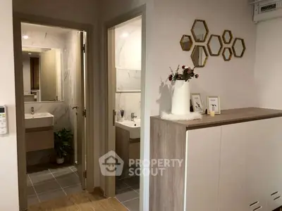Modern bathroom with stylish decor and elegant fixtures in a contemporary apartment.