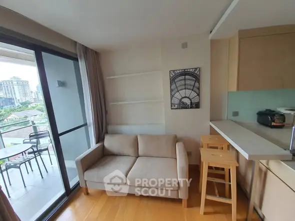 Modern apartment with cozy living area and balcony view