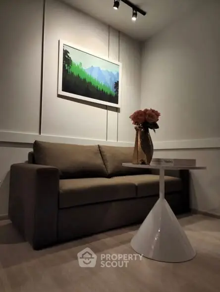 Cozy living room with modern sofa and stylish decor, perfect for relaxation.