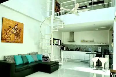 Stunning modern loft with spiral staircase and open kitchen layout, perfect for stylish urban living.