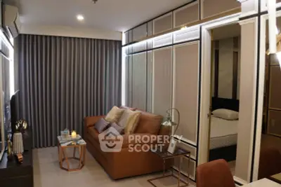 Modern living room with elegant decor and cozy seating in a stylish apartment.