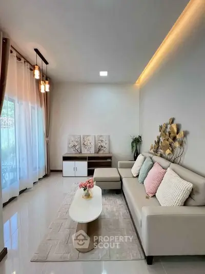 Elegant living room with modern decor, cozy sofa, and stylish lighting, perfect for relaxation and entertaining.