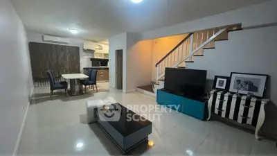 Spacious modern living room with open kitchen and stylish decor