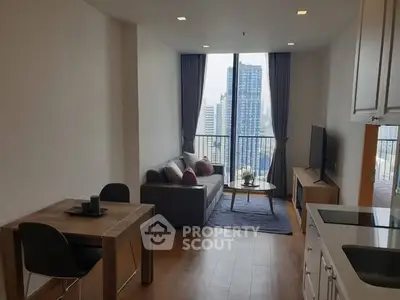Modern living room with city view, featuring sleek furniture and open layout, perfect for urban living.