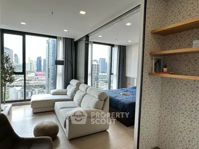 Modern condo living room with city view and cozy bedroom
