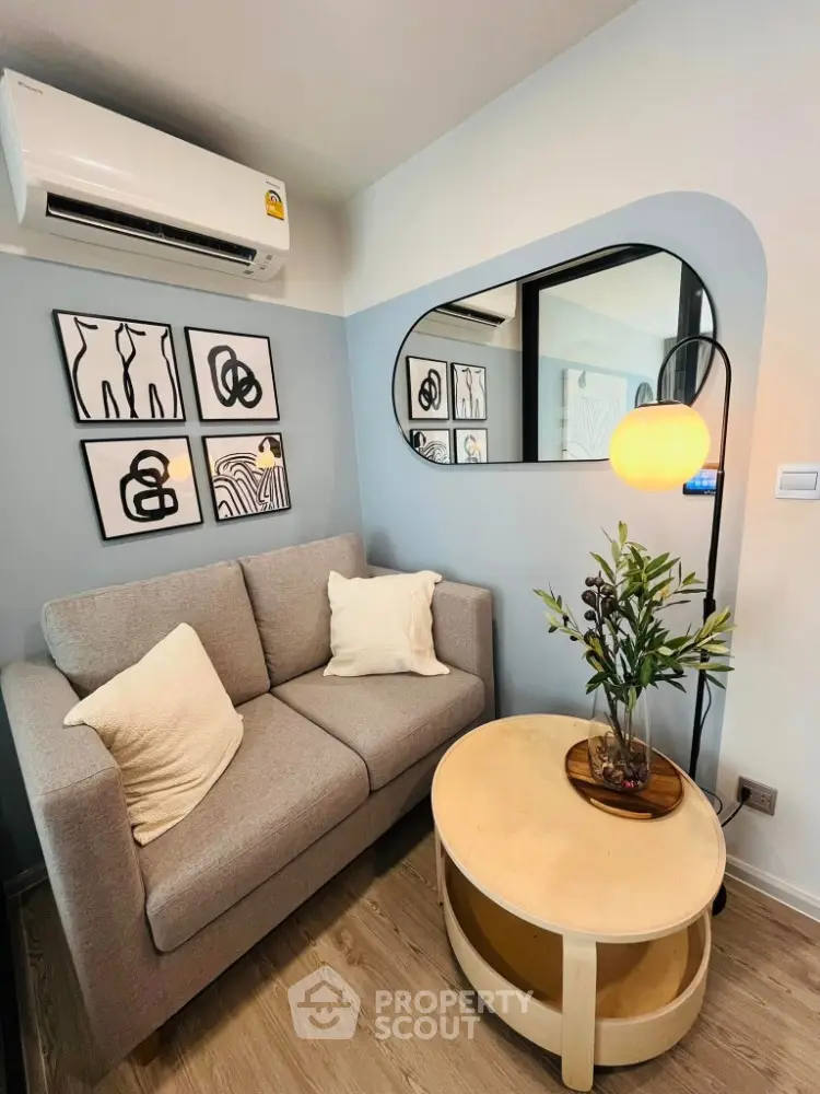 Chic modern living room with stylish decor and cozy sofa, perfect for urban living.