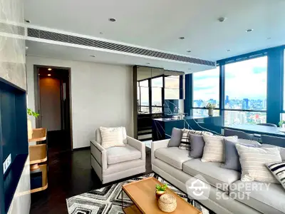 Luxurious modern living room with city view, elegant furniture, and abundant natural light.