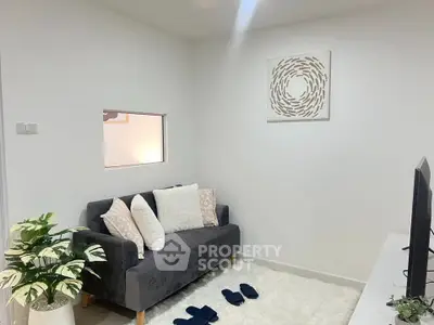 Cozy living room with modern decor and plush seating