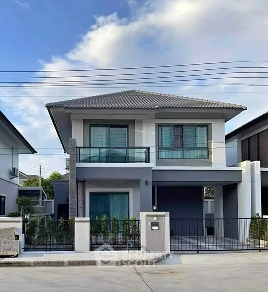 Modern two-story house with sleek design and spacious driveway
